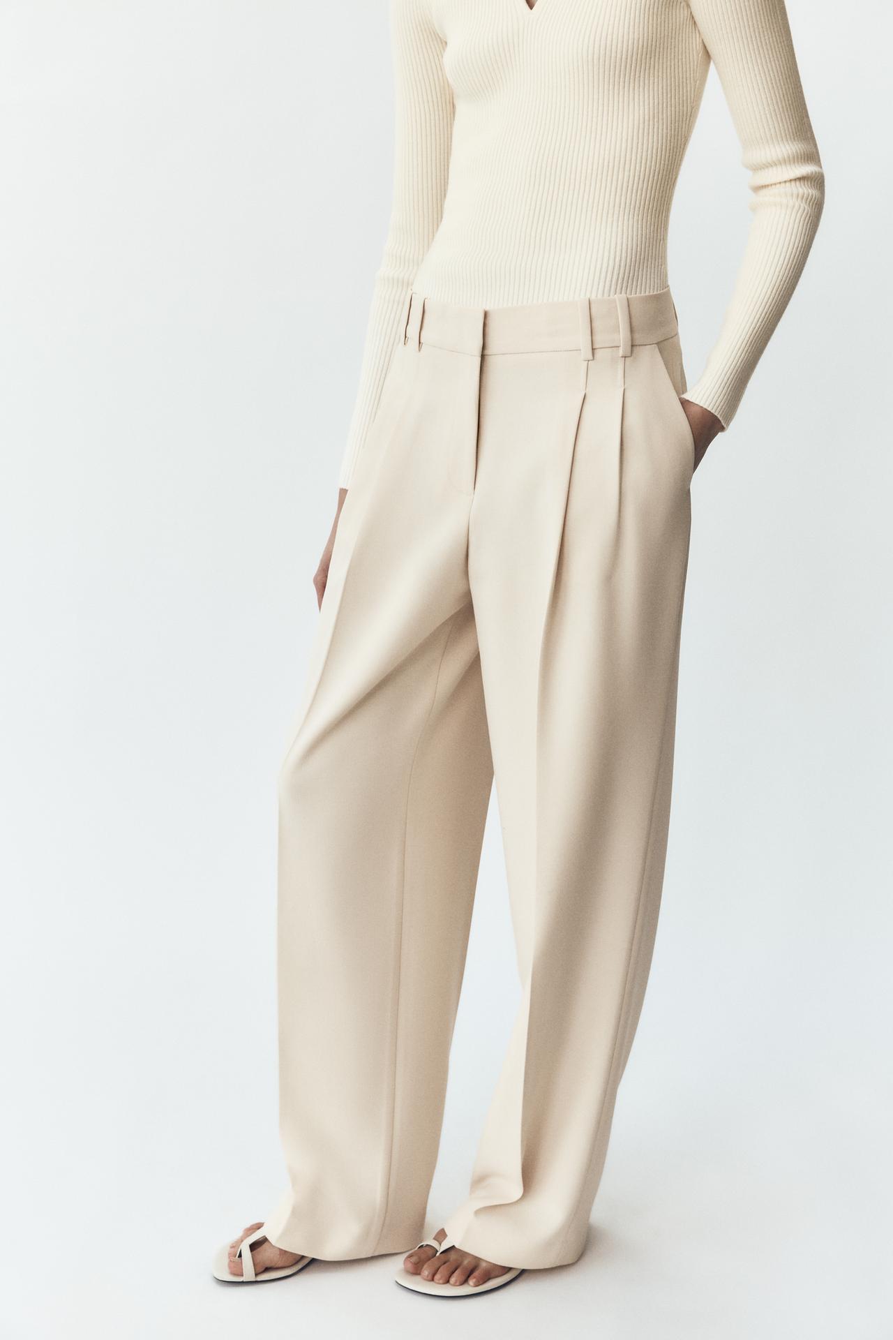 CALÇA LARGA COM PREGAS