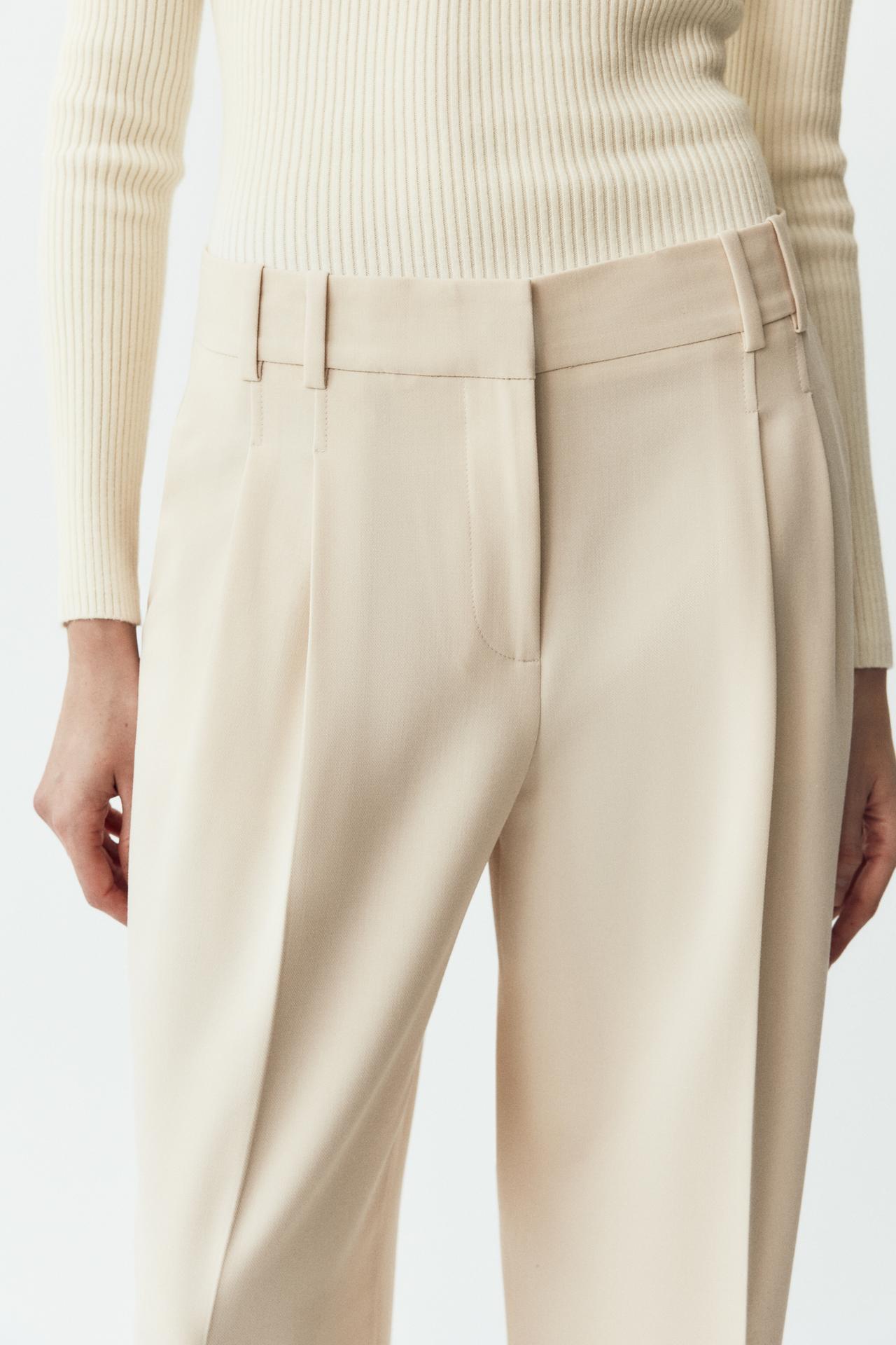 CALÇA LARGA COM PREGAS