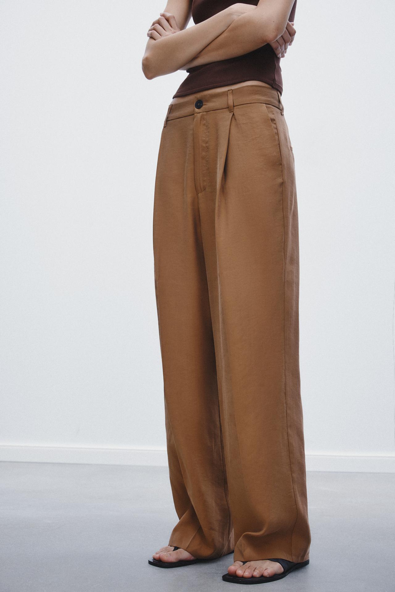 CALÇA COM PREGA