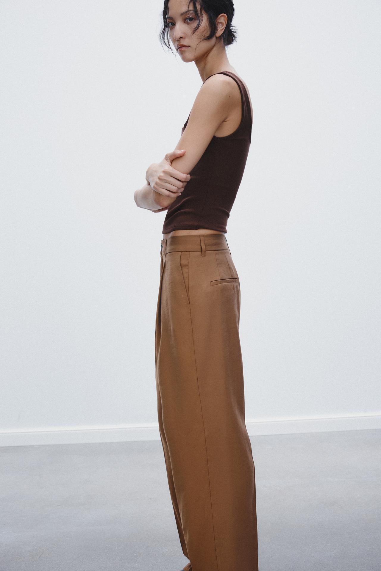 CALÇA COM PREGA